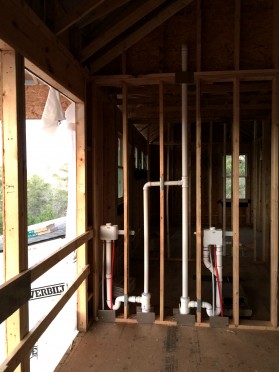 The utility room plumbing (hookups for two washing machines)
