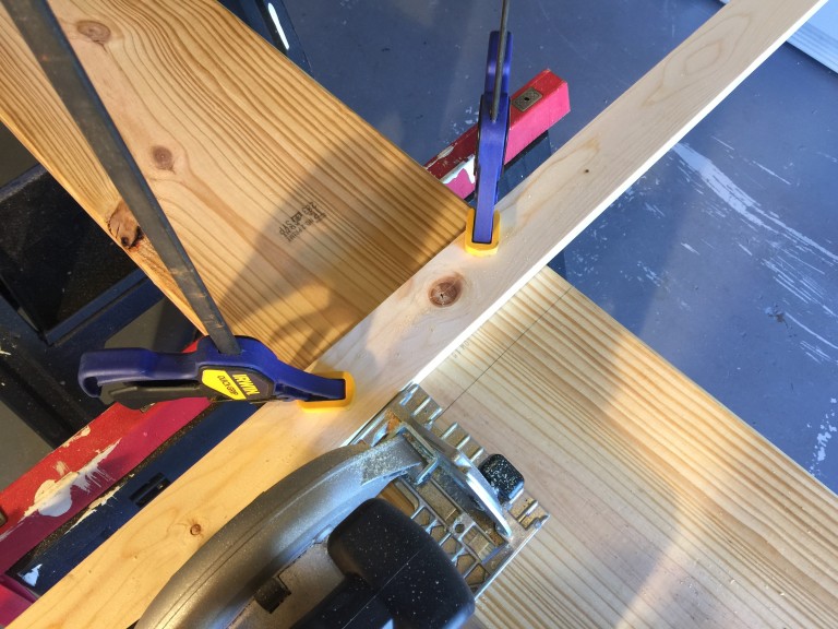 Use a guide clamped to the wood to ensure a straight cut