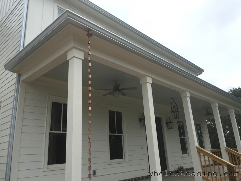 The rain chains are mounted on either side of the front porch