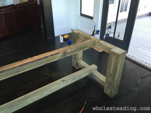 Finish connecting the top and bottom beams to the table ends
