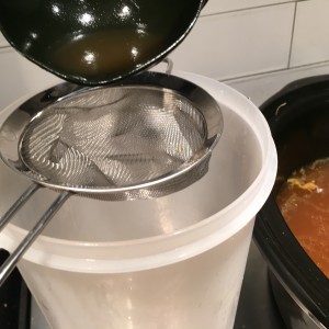 Making Chicken Stock: Strain Out the Solids